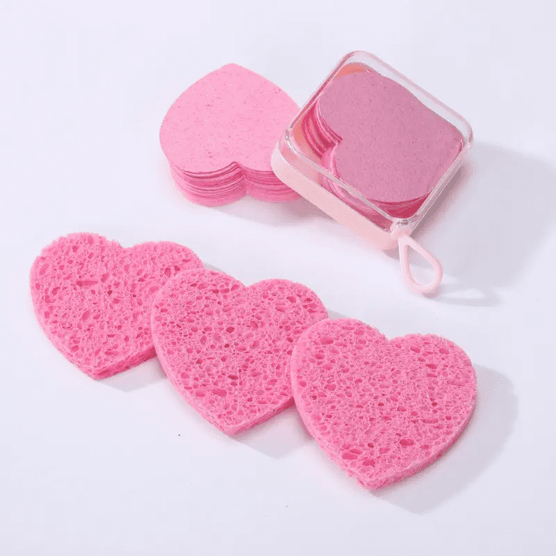 Compact case of pink heart-shaped compressed sponges by Gleamax™